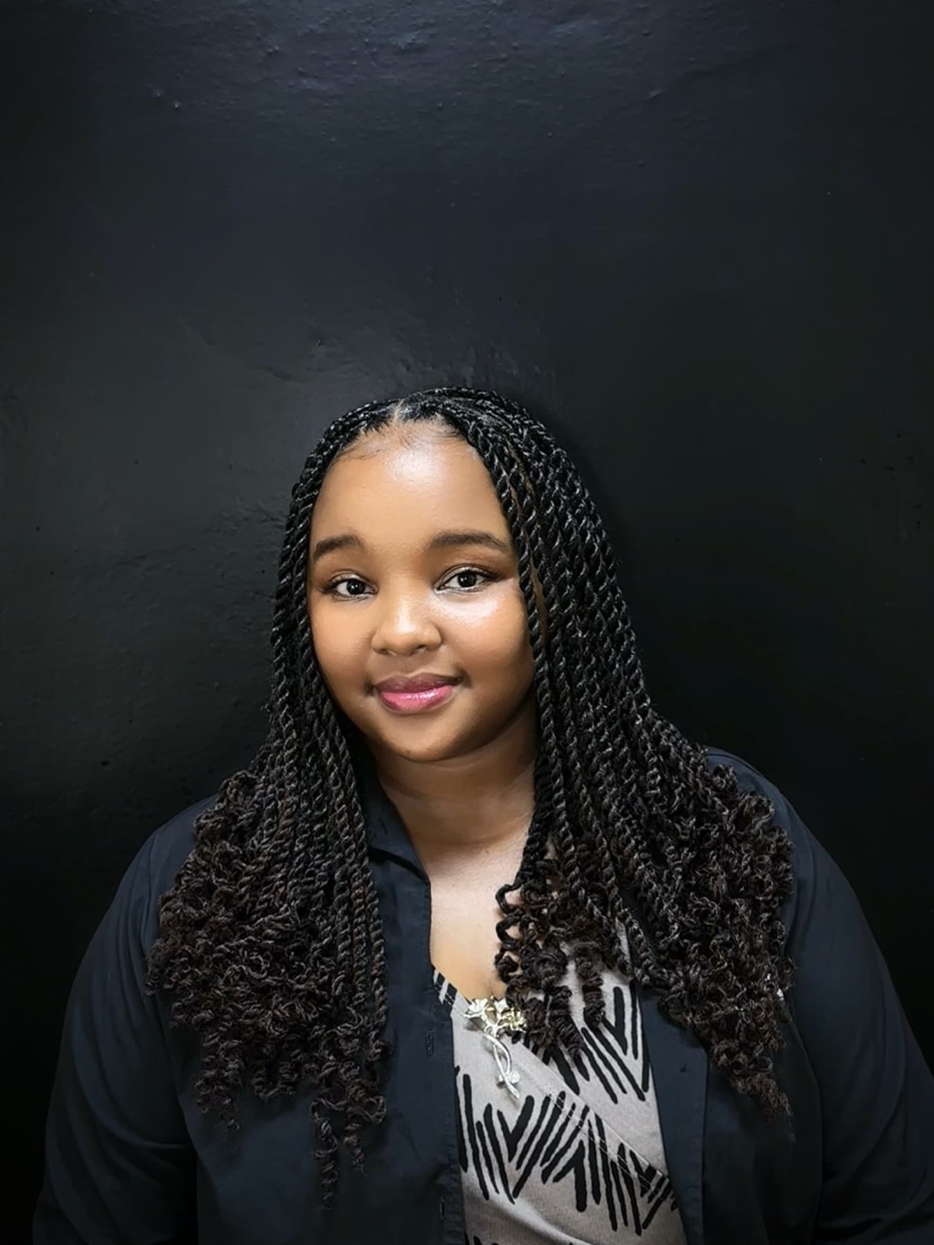 Curly braids with a centre part