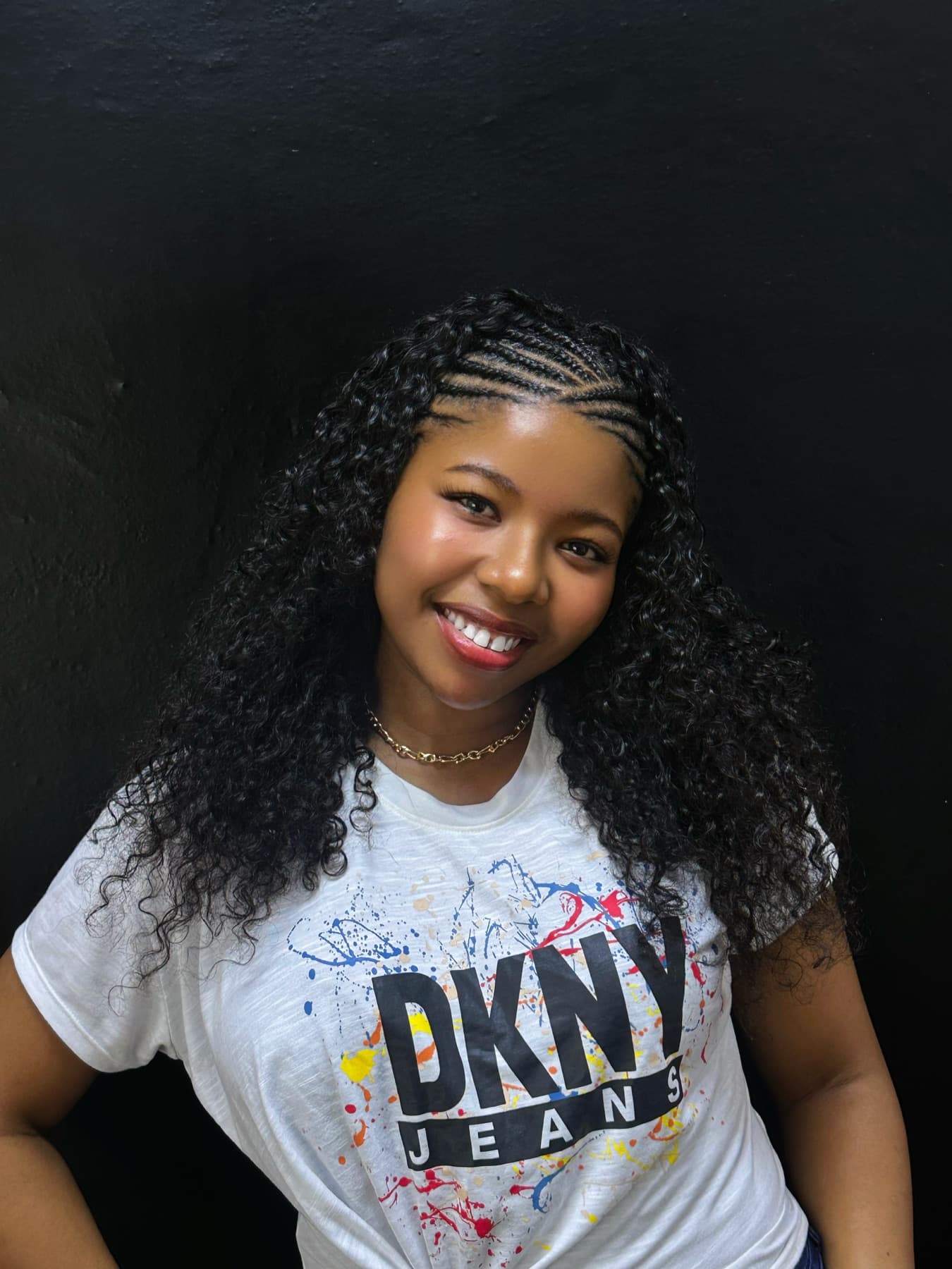 Client wearing curly Fulani braids styled at Yadah Braids
